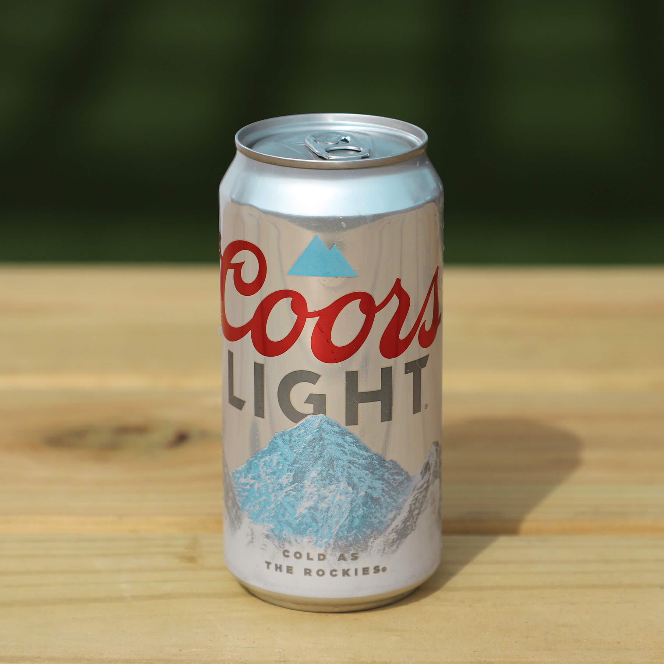 Coors Light Can sitting in the backyard